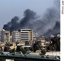Smoke rises from the site of two explosions in central Baghdad, 22 Jan 2007