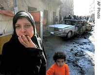 A woman reacts at scene of a car bomb blast in predominantly Shi'ite commercial district of Karradah in downtown Baghdad, 23 Jan 2007