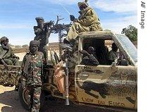 United Front for Change (FUC) fighters patrol in Guereda, 13 Jan 2007