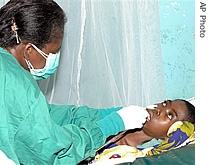 A nurse attends to one of the Rifty Valley fever patients,after she was admitted at the district hospital in Kilifi Kenya, 05 Jan 2007