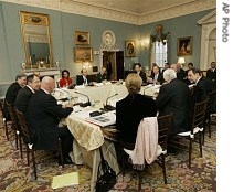 Secretary of State Condoleezza Rice, back row in red suit, hosts meeting of the Mideast Quartet, at the State Department in Washington