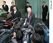 U.S. Assistant Secretary of State Christopher Hill, center, speaks to reporters after his meeting with chief North Korean negotiator Kim Kye Gwan, 9 Feb 2007