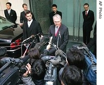 U.S. Assistant Secretary of State Christopher Hill, center, speaks to reporters after his meeting with chief North Korean negotiator Kim Kye Gwan, 9 Feb 2007
