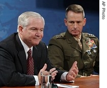 Defense Secretary Robert Gates, left, accompanied by Joint Chiefs Chairman General Peter Pace, gestures during a news conference at the Pentagon