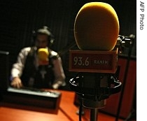 A RAM FM radio station employee works at the studio in the West Bank city of Ramallah