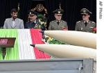 President Mahmoud Ahmadinejad, left, reviews army missiles during parade commemorating Army Day