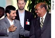 Sudanese President Omar el-Bashir, right, chats with his Iranian counterpart Mahmoud Ahmadinejad before their talks in Khartoum, Sudan, Wednesday, 28 Feb. 2007