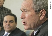 President Bush, right, speaks with reporters, as he meets with El Salvador's President Tony Saca, in the Oval Office, 27 Feb. 2007