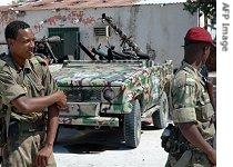 Ethiopian soldiers walk past a technical vehicle of the Islamic Courts movement in Mogadishu, 18 Jan 2007