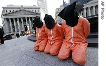 Protesters dressed as Guantanamo detainees demonstrate in front of Manhattan Supreme Court, 11 Jan. 2007