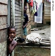 A young girl leans out of the doorway of her house in a slum neighbourhood of Malabo, capital of Equatorial Guinea (File)
