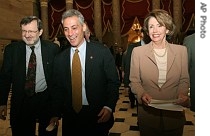 House Speaker Nancy Pelosi, right, accompanied by Rahm Emanuel, center, and David Obey, walk to the Speaker's office on Capitol Hill in Washington, Mar 23, 2007