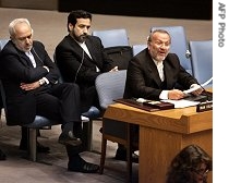 Iranian Foreign Minister Manouchehr Mottaki speaks (R) as Iranian Ambassador to the United Nations Jared Zarif (L) listens after members of the Security Council voted to put new sanctions on Tehran