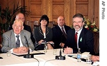 Democratic Unionist Party leader Ian Paisley, left, and Sinn Fein President Gerry Adams speak to reporters, 26 Mar. 2007