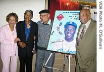 (Left to Right) Gloria May Barlett, Ray Isum, Ray Bartlett, and on the right side of the Jackie Robinson poster, James Ronnie Colbert