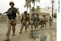 U.S. and Iraqi army soldiers patrol an area in Baghdad's al-Karrada neighborhood, 24 Mar 2007