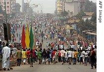 Protesters march during a demonstration, part of a general strike in Conakry, 22 Jan 2007