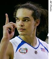 Florida's Joakim Noah (13) signals to the stands after the Gators defeated UCLA 76-66 in the men's semifinal basketball game at the Final Four in the Georgia Dome in Atlanta, 31 Mar 2007