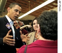 Barack Obama, left, talks to voters during campaign stop in Rochester, New Hampshire, 03 Apr 2007