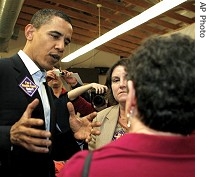 Barack Obama, left,  talks to voters during campaign stop in Rochester, New Hampshire, 03 Apr 2007