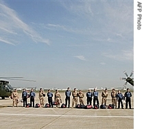 Fifteen British navy personnel held captive in Iran pose for a photograph upon their arrival at Heathrow airport, in west London, 05 Apr 2007