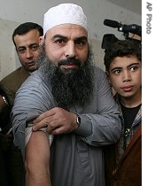 Egyptian cleric Osama Hassan Mustafa Nasr, known as Abu Omar, shows a dark scar on his arm during his first public appearance since he was released from Egyptian custody, 22 Feb 2007