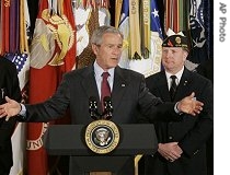President Bush stands with veterans as he speaks about the Iraq war supplemental, at the American Legion Post 177 in Fairfax, Virginia, 10 Apr 2007