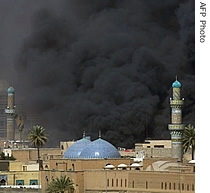 Smoke billows from the site of a car bomb attack engulfing Bab al-Moazam Mosque in Baghdad 05 Mar 2007