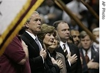 President Bush (l) and Laura Bush, second from left, Virginia Gov. Timothy M. Kaine (r) participate in a convocation to honor the victims of a shooting rampage at Virginia Tech, 17 Apr 2007