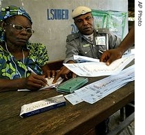 Electoral officials count ballots at a polling station in Lagos, Nigeria
