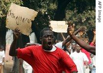 Protesters march during a demonstration, part of a general strike in Conakry, 22 Jan 2007