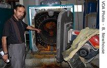 Hospital engineer Khaldoon Tahsin points out a broken boiler