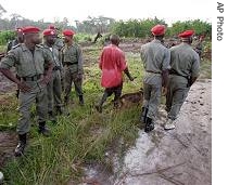 Cameroon troops provide security at the crash site of a Kenya airline plane in Mbanga Pongo, Cameroon, 07 May 2007