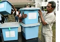 Election workers prepare ballot boxes to be distributed to remote sub-districts after a ceremony at the local district office in Dili, East Timor, 08 May 2007