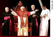 Pope Benedict XVI gestures to the faithful at the Pacaembu Stadium in Sao Paulo, Brazil, 10 May 2007