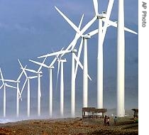Villagers are dwarfed by giant windmills built by the Danish Development Agency in northern Philippines (File)