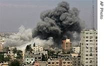 Smoke rises from an explosion following an Israeli airstrike on a building used by the militant group Hamas in Gaza City, Thursday, 17 May 2007