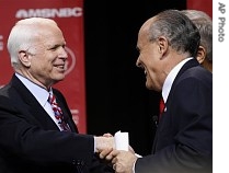 Republican presidential hopefuls John McCain, left, and Rudy Giuliani greet each other after the first republican presidential primary debate of the 2008 election, 3 May 2007