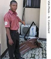 A Guard shows destruction inside Indian compound, 19 May 2007  