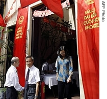 Residents leave a voting station in Hanoi, 20 May 2007