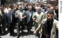 Palestinian Prime Minister Ismail Haniya (2nd L), Hamas leader Khalil al-Haya(C),Hamas MP Ahmed Bahar(L)attend mass funeral for nine victims of al-Haya family killed in Israeli air strike