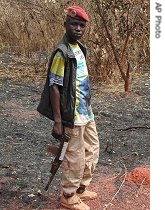 Simplice Tolmbaye, a 14-year-old rebel fighter, poses for a picture in the bush near Ouandago, Central African Republic (Dec 2006)