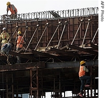 Indian construction workers work on a building site in New Delhi (File)