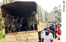 Kenyan police officers investigate violence believed to be caused by outlawed Mungiki sect, 17 April 2007