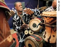 An unidentified Nigerian man plays African drums at a show to mark 2006 World Music Day in Lagos, Nigeria