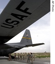 US soldiers are seen near a US Air Force plane at the main US air base in Bagram, Afghanistan Tuesday, May 29, 2007