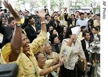 Supporters of Democrat Party cheer and shout after hearing a verdict of constitution court in their favor, 30 May 2007