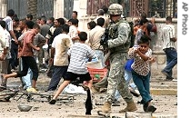 Iraqi boy takes cover behind US soldier after gunshots ring out in busy central Baghdad commercial district, 28 May 2007