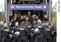 Anti-globalisation protesters are stopped and searched by police as they leave the train station in the north-eastern town of Warnemuende, Germany, 05 Jun 2007