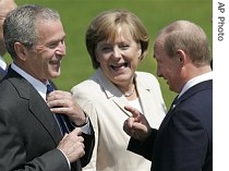 US President George Bush, left, German Chancellor Angela Merkel, center and Russian President Vladimir Putin, right share a laugh during the G8 summit in Heiligendamm, 8 June 2007